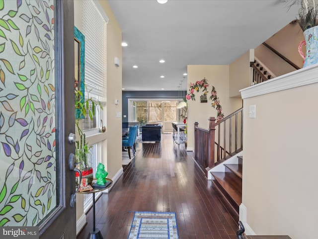 foyer with recessed lighting, stairs, baseboards, and hardwood / wood-style flooring