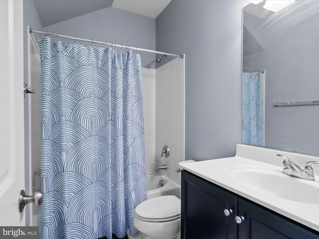 bathroom featuring vanity, vaulted ceiling, toilet, and shower / bath combo