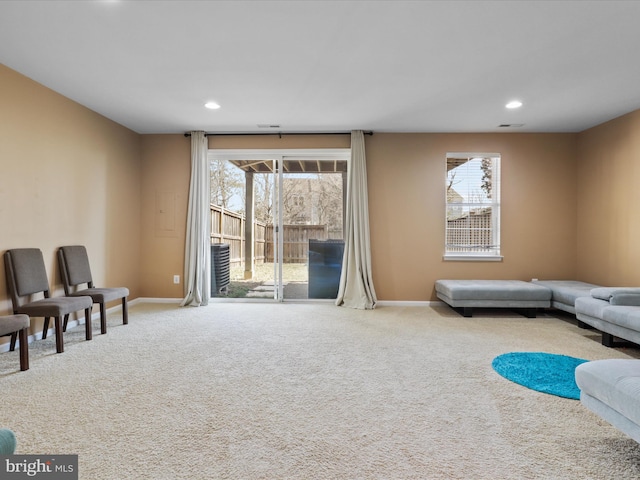 sitting room with recessed lighting, baseboards, and carpet floors