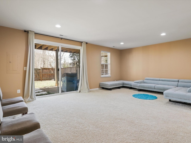 carpeted living room featuring recessed lighting and baseboards