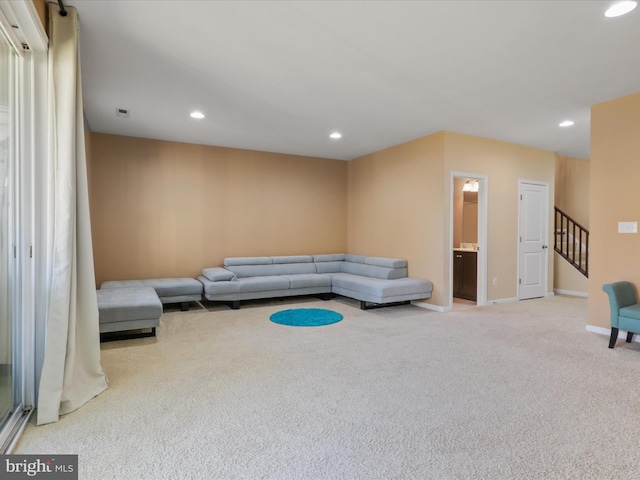 living area with recessed lighting, stairway, carpet floors, and baseboards