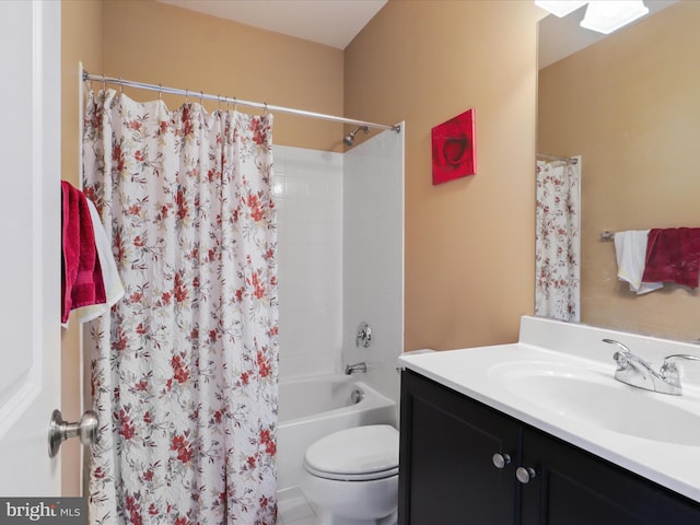 full bathroom with toilet, vanity, and shower / tub combo with curtain