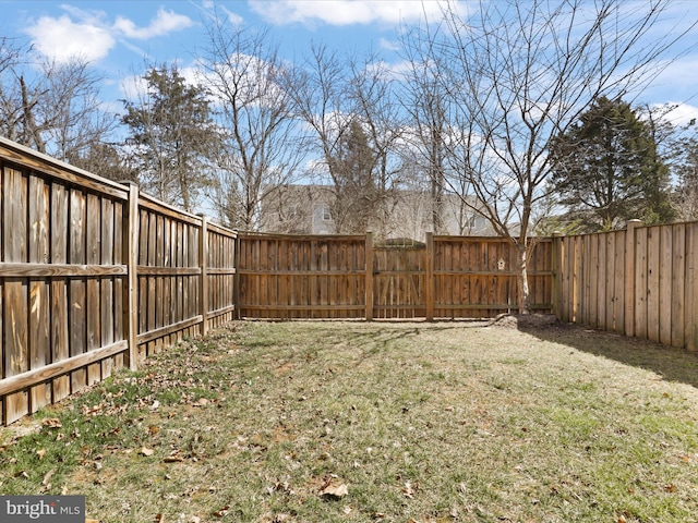 view of yard with a fenced backyard