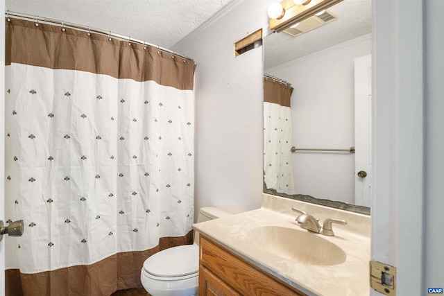 bathroom with vanity, visible vents, a textured ceiling, crown molding, and toilet