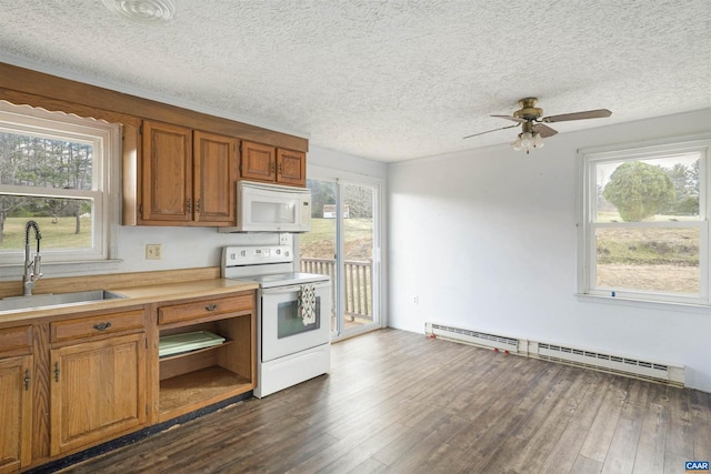 kitchen featuring a sink, dark wood-style floors, white appliances, brown cabinetry, and a baseboard radiator