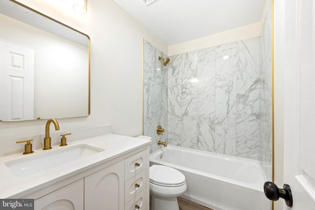 full bathroom featuring vanity, toilet, and washtub / shower combination