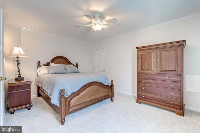 bedroom featuring crown molding, baseboards, and light carpet