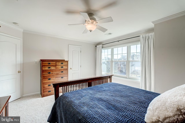 bedroom with a ceiling fan, baseboards, visible vents, light carpet, and crown molding