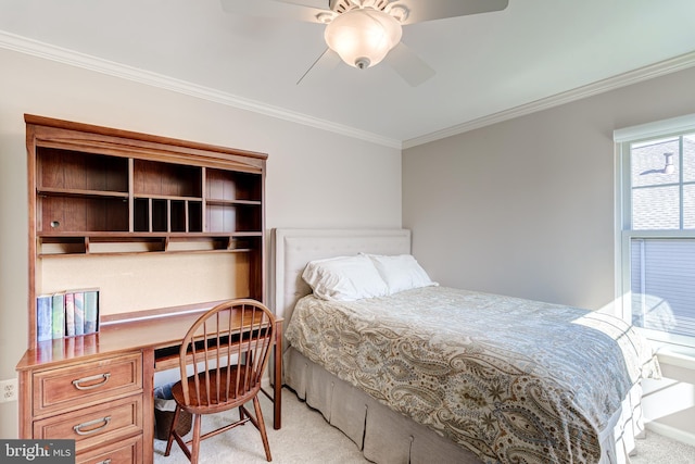 carpeted bedroom with ceiling fan and ornamental molding