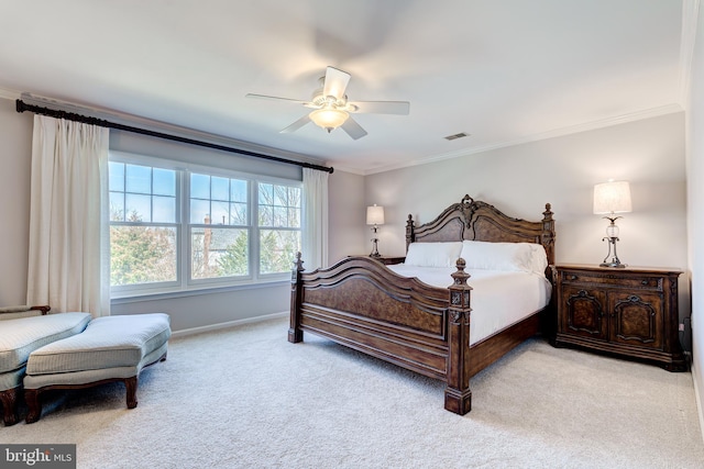 carpeted bedroom featuring visible vents, baseboards, ceiling fan, and ornamental molding