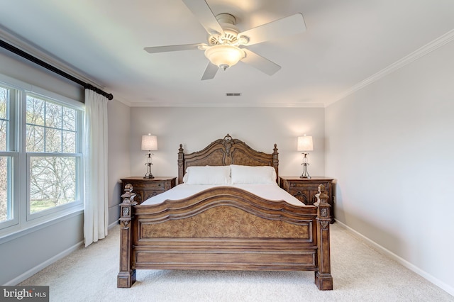 bedroom with visible vents, crown molding, ceiling fan, baseboards, and light carpet