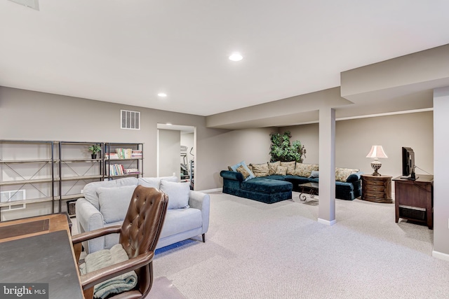 carpeted living room with visible vents, recessed lighting, and baseboards