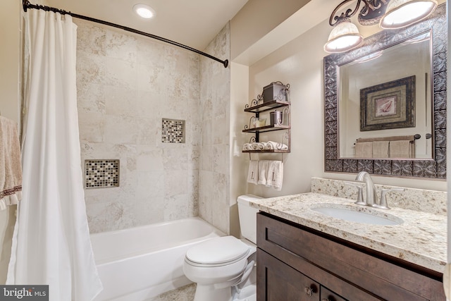 full bath with toilet, vanity, and shower / tub combo