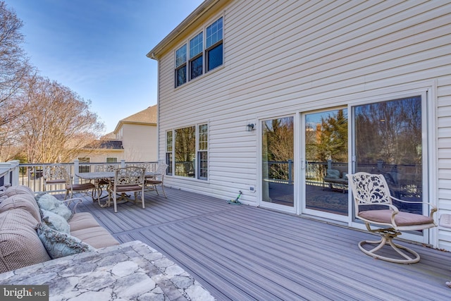 deck featuring outdoor dining space