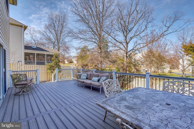 wooden terrace featuring outdoor dining space