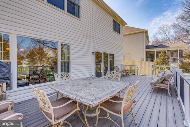 wooden deck featuring outdoor dining space