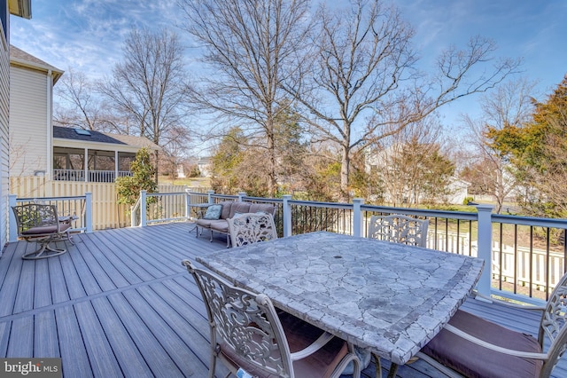 wooden deck featuring outdoor dining space