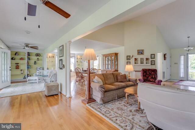 1629 Pondview Dr, Winchester, VA 22601 - living area featuring ceiling fan, ornate columns, high vaulted ceiling, wood finished floors, and built in features