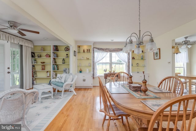1629 Pondview Dr, Winchester, VA 22601 - dining room featuring a ceiling fan, healthy amount of natural light, light wood-type flooring, and a chandelier