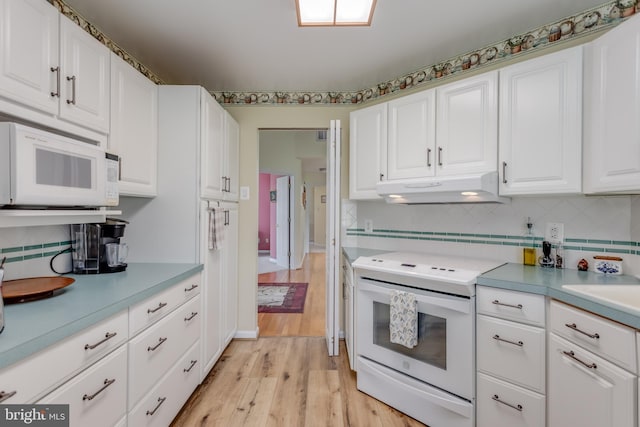1629 Pondview Dr, Winchester, VA 22601 - kitchen featuring white appliances, under cabinet range hood, white cabinetry, backsplash, and light wood-type flooring