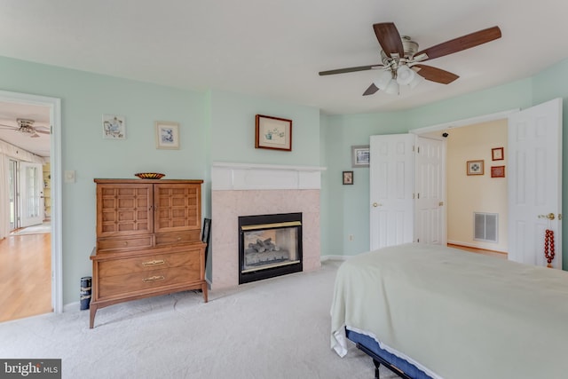 1629 Pondview Dr, Winchester, VA 22601 - bedroom with a tiled fireplace, carpet floors, and ceiling fan