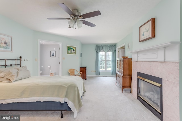 1629 Pondview Dr, Winchester, VA 22601 - bedroom with a tiled fireplace, light carpet, ensuite bathroom, and a ceiling fan