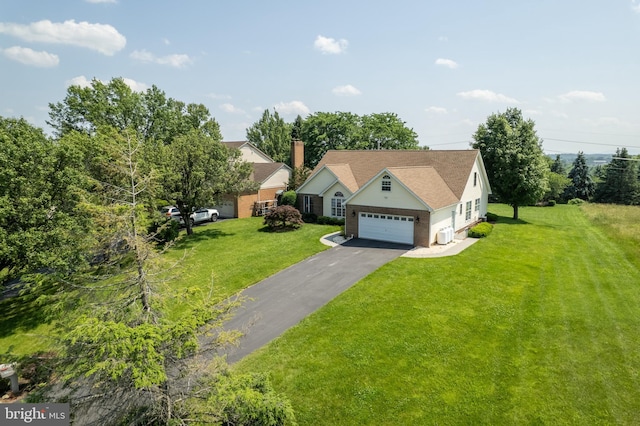 1629 Pondview Dr, Winchester, VA 22601 - view of front of home with a front yard, asphalt driveway, and brick siding