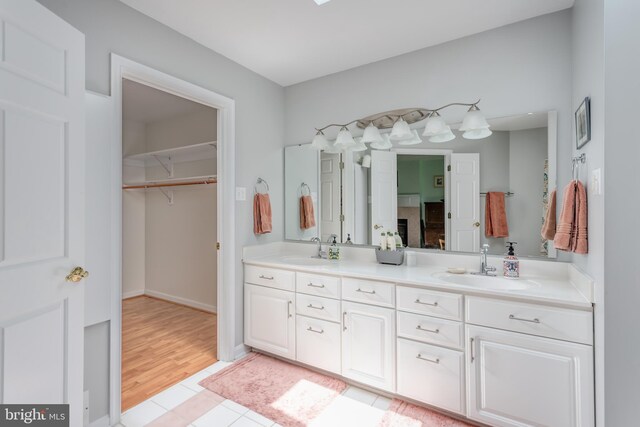 1629 Pondview Dr, Winchester, VA 22601 - bathroom with double vanity, a walk in closet, and tile patterned floors