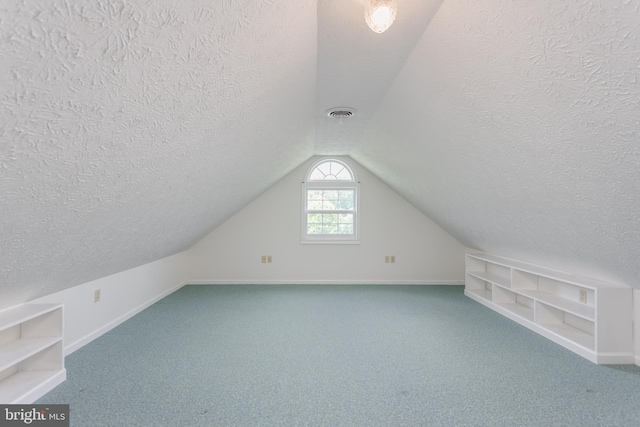 1629 Pondview Dr, Winchester, VA 22601 - bonus room featuring a textured ceiling, carpet floors, and vaulted ceiling