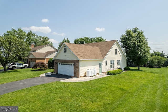 1629 Pondview Dr, Winchester, VA 22601 - view of front of home featuring a front lawn, driveway, a shingled roof, and a garage