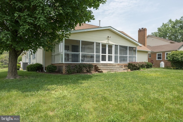 1629 Pondview Dr, Winchester, VA 22601 - back of property featuring a sunroom, a yard, and brick siding