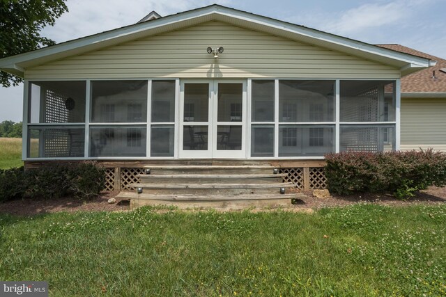 1629 Pondview Dr, Winchester, VA 22601 - rear view of property with a sunroom, a yard, and a shingled roof