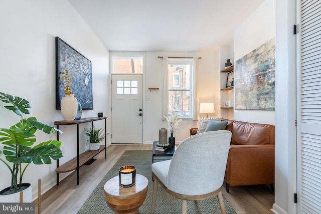 living room featuring baseboards and wood finished floors