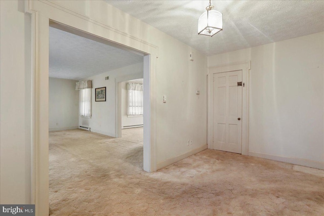 carpeted foyer entrance featuring a textured ceiling, a baseboard heating unit, baseboards, and a baseboard radiator