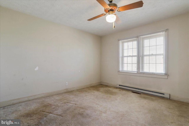 empty room featuring a ceiling fan, baseboards, carpet floors, a baseboard radiator, and a textured ceiling