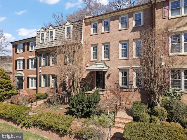 view of front of home with brick siding