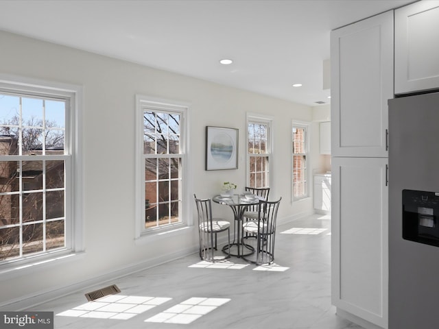 dining area featuring recessed lighting, visible vents, marble finish floor, and baseboards