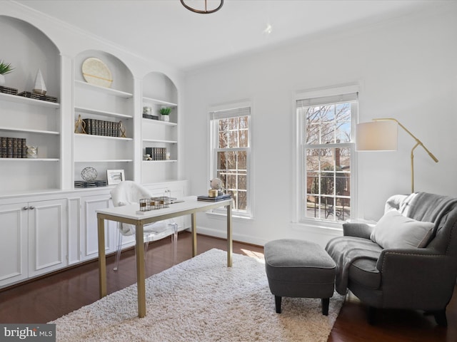 home office featuring built in features and dark wood-style flooring