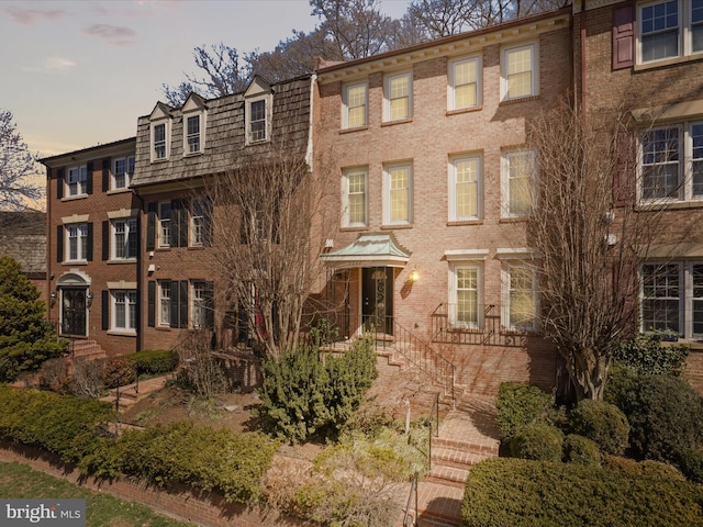 view of front facade featuring brick siding