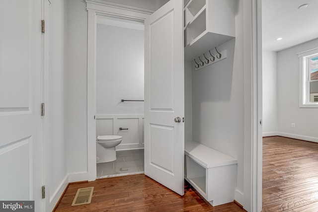 mudroom featuring visible vents and wood finished floors