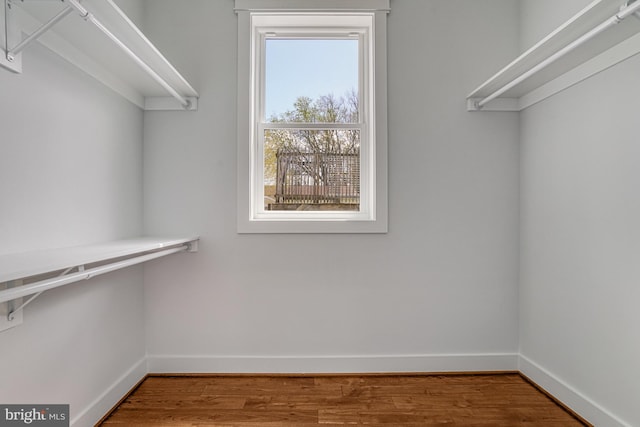 spacious closet with wood finished floors