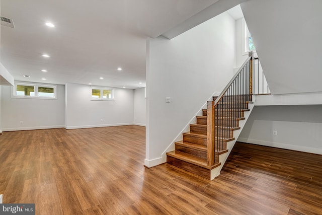 basement with visible vents, baseboards, recessed lighting, and wood finished floors