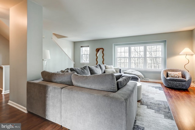 living room with baseboards and wood finished floors