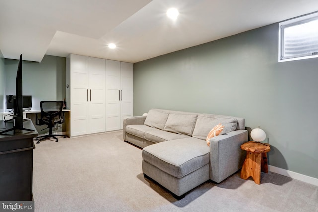 living area with recessed lighting, baseboards, and light carpet