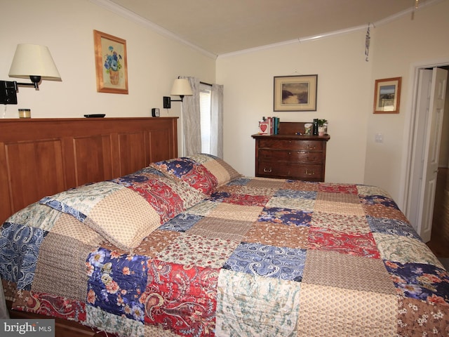 bedroom with crown molding and vaulted ceiling