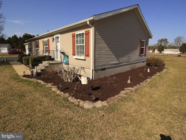 view of home's exterior with a yard and crawl space