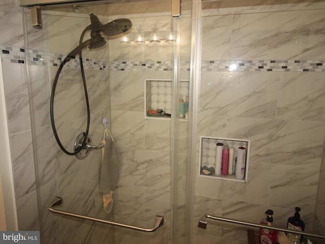 bathroom featuring a shower stall