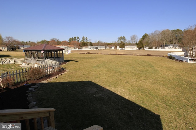 view of yard featuring a gazebo and fence