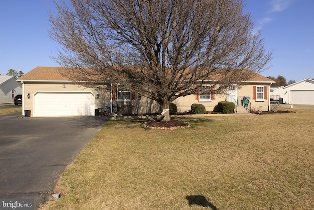 ranch-style home with a front lawn, a garage, driveway, and crawl space