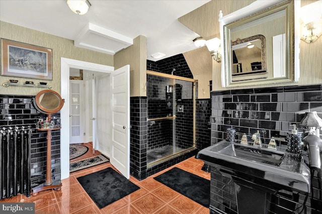 full bathroom featuring tile patterned flooring and a stall shower